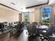 Elegant conference room with a table, seating and a view, ideal for meetings and collaborative work at 11248 Juglans Dr, Odessa, FL 33556