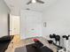 Bright workout room featuring ceiling fan, tile floors, and exercise equipment at 11248 Juglans Dr, Odessa, FL 33556