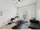 Bright workout room featuring a ceiling fan and a view from the exterior window at 11248 Juglans Dr, Odessa, FL 33556