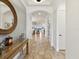 Inviting home foyer with a front door, neutral flooring, and arched ceilings at 11248 Juglans Dr, Odessa, FL 33556