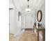Inviting home foyer with a front door, natural lighting, and neutral flooring at 11248 Juglans Dr, Odessa, FL 33556