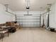 Spacious two-car garage with epoxy floor, garage door opener, and ample storage at 11248 Juglans Dr, Odessa, FL 33556