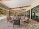 Spacious covered patio featuring ample seating, perfect for entertaining and enjoying the outdoor ambiance at 11248 Juglans Dr, Odessa, FL 33556