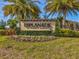 Entrance sign for Esplanade at Starkey Ranch surrounded by landscaping and flowers at 11248 Juglans Dr, Odessa, FL 33556