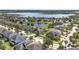 A beautiful neighborhood featuring well-maintained homes, green spaces, and a scenic lake at 11327 Emerald Shore Dr, Riverview, FL 33579