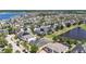 A panoramic shot of a residential community next to a pond, showcasing well-maintained landscaping at 11327 Emerald Shore Dr, Riverview, FL 33579