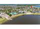 Aerial view of the neighborhood and lake, with community pool, clubhouse, and convenient location at 11327 Emerald Shore Dr, Riverview, FL 33579