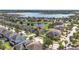 An aerial view highlighting a beautiful neighborhood with manicured lawns and a tranquil lake view at 11327 Emerald Shore Dr, Riverview, FL 33579