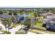 Aerial view showcasing the community, lake and nearby homes at 11327 Emerald Shore Dr, Riverview, FL 33579