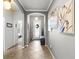 Elegant entryway featuring tile flooring, arched doorways, neutral paint, and stylish decor at 11327 Emerald Shore Dr, Riverview, FL 33579