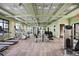 Well-equipped gym with modern exercise equipment, including treadmills, ellipticals, and weight machines at 11327 Emerald Shore Dr, Riverview, FL 33579