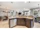 Well-equipped kitchen area with granite counters, a stainless dishwasher, and open layout to other living spaces at 11327 Emerald Shore Dr, Riverview, FL 33579