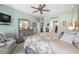 Spacious primary bedroom with a ceiling fan, ensuite bathroom, and walk-in closet, creating a private retreat at 11327 Emerald Shore Dr, Riverview, FL 33579