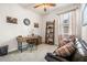 Functional home office with a wooden desk, comfortable chair, and bookshelf, perfect for working from home at 11327 Emerald Shore Dr, Riverview, FL 33579