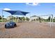 Community playground with climbing structures, swings, and a soft landing area for children at 11327 Emerald Shore Dr, Riverview, FL 33579