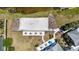 Aerial view of beach volleyball court adjacent to the amenity center and pool at 11327 Emerald Shore Dr, Riverview, FL 33579