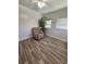 Bedroom featuring hardwood floors, a ceiling fan, and natural light at 1200 Abbey Crescent Ln, Clearwater, FL 33759