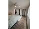 Inviting bedroom with wood floors and ample closet space, great for keeping your belongings organized and accessible at 1200 Abbey Crescent Ln, Clearwater, FL 33759