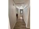 Hallway featuring wood-look floors leads to the bedroom and bathroom at 1200 Abbey Crescent Ln, Clearwater, FL 33759