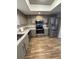 Updated kitchen features stainless steel appliances, granite countertops, and modern finishes at 1200 Abbey Crescent Ln, Clearwater, FL 33759