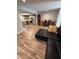 Open concept living room showcasing kitchen, dining, and living area at 1200 Abbey Crescent Ln, Clearwater, FL 33759