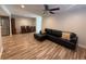 Open-concept living space with wood flooring and stainless appliances at 1200 Abbey Crescent Ln, Clearwater, FL 33759