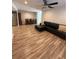 Open-concept living space with wood flooring and stainless appliances at 1200 Abbey Crescent Ln, Clearwater, FL 33759