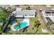 Aerial view showcasing a pool, backyard, patio, and home, providing a comprehensive look at the property at 1209 W Camellia Dr, Brandon, FL 33510