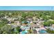Neighborhood aerial view highlighting many homes in a suburban community surrounded by lush trees at 1209 W Camellia Dr, Brandon, FL 33510