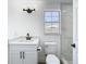 Updated bathroom with modern vanity, toilet, and window showcasing the bright natural light at 1209 W Camellia Dr, Brandon, FL 33510