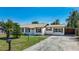 Inviting single-story home with a well-maintained lawn, mailbox, and convenient carport at 1209 W Camellia Dr, Brandon, FL 33510
