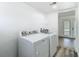 Bright laundry room with modern appliances, leading to outdoor pool area at 1209 W Camellia Dr, Brandon, FL 33510
