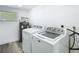 Laundry room equipped with modern appliances and a water heater at 1209 W Camellia Dr, Brandon, FL 33510