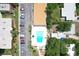 Aerial view showcasing the community pool, parking lot, and surrounding green spaces at 12760 Indian Rocks Rd # 579, Largo, FL 33774