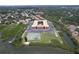 Stunning aerial view of waterfront condo complex with tennis court, ample parking, and lush greenery at 12760 Indian Rocks Rd # 579, Largo, FL 33774