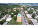 Aerial photo of neighborhood, displaying condo complex, community pool, trees, and nearby parking at 12760 Indian Rocks Rd # 579, Largo, FL 33774