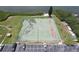 Aerial view of community tennis court and nearby canoe storage by the water at 12760 Indian Rocks Rd # 579, Largo, FL 33774