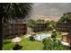 Exterior view of the pool area, tiki umbrellas and nicely landscaped common area of this multi Gathering building at 12760 Indian Rocks Rd # 579, Largo, FL 33774