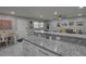 Open-concept kitchen with granite counters and a view into the living space at 12760 Indian Rocks Rd # 579, Largo, FL 33774