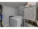 Laundry room with white washer and dryer units and a water heater at 12760 Indian Rocks Rd # 579, Largo, FL 33774