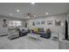 Cozy living area with neutral tones, a ceiling fan, and comfortable seating at 12760 Indian Rocks Rd # 579, Largo, FL 33774