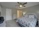 Relaxing bedroom featuring a full bed with neutral decor and soft lighting at 12760 Indian Rocks Rd # 579, Largo, FL 33774