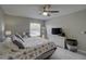 Comfortable main bedroom with a woven dresser and television at 12760 Indian Rocks Rd # 579, Largo, FL 33774