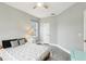 Comfortable bedroom with grey walls, plush carpet, a window and a door adding character to the room at 16113 Ternglade Dr, Lithia, FL 33547
