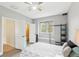 Stylish bedroom featuring a bed with decorative pillows, a built in window seat and a shelving unit at 16113 Ternglade Dr, Lithia, FL 33547