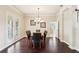 Formal dining area with hardwood floors, natural light, and classic decor at 16113 Ternglade Dr, Lithia, FL 33547