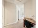Hallway with built-in desk and carpet floors at 16113 Ternglade Dr, Lithia, FL 33547