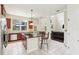Spacious kitchen boasts stainless appliances, granite counters, and a breakfast bar connecting to the living area at 16113 Ternglade Dr, Lithia, FL 33547
