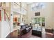 Spacious living room with high ceilings, large windows, and an open floor plan at 16113 Ternglade Dr, Lithia, FL 33547
