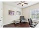 Inviting office space with hardwood floors, a comfortable chair, and serene views from the window at 16113 Ternglade Dr, Lithia, FL 33547